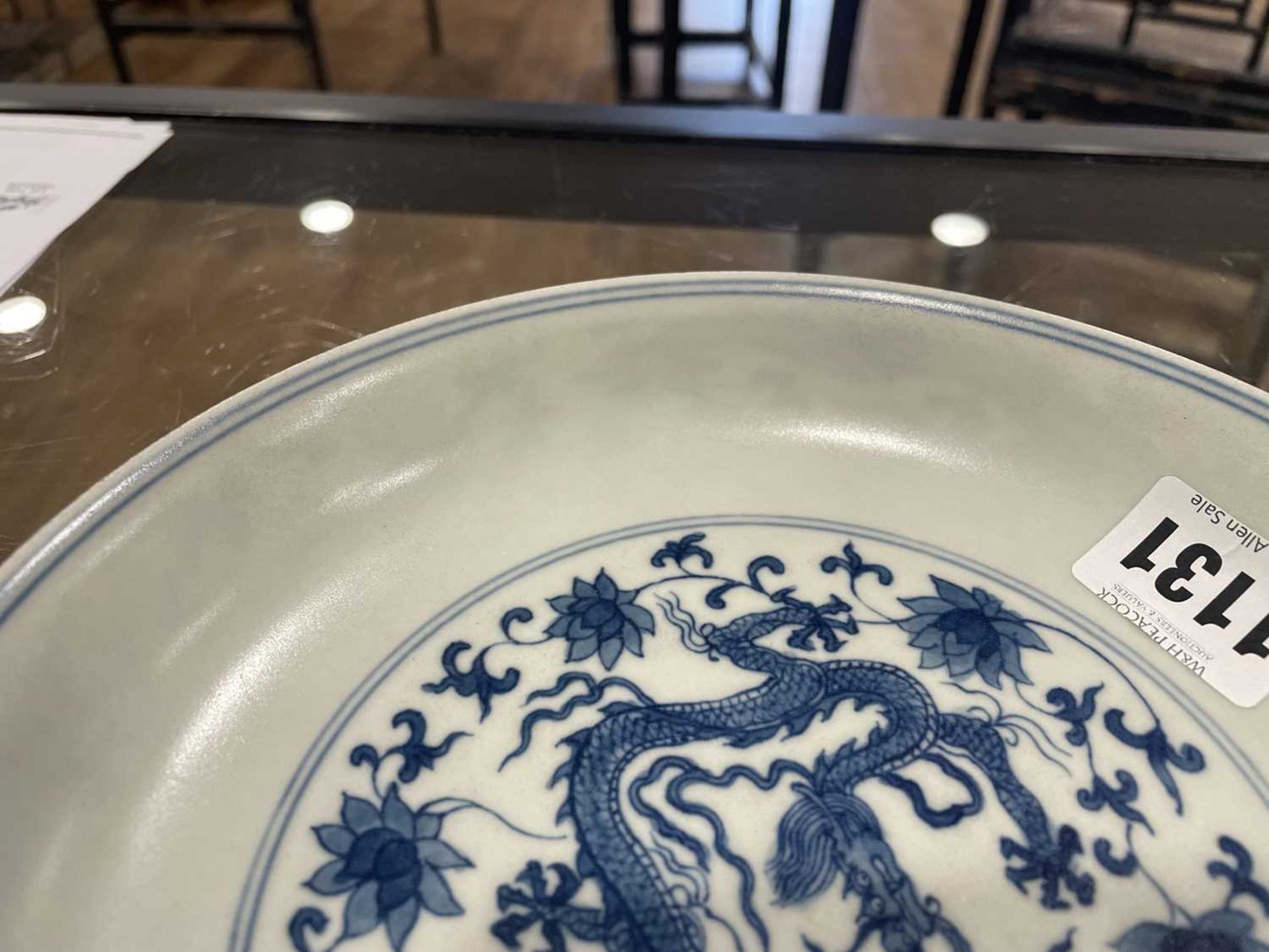 A Chinese blue and white shallow dish, centrally decorated with a dragon and lotus flowers, pseudo - Image 26 of 31