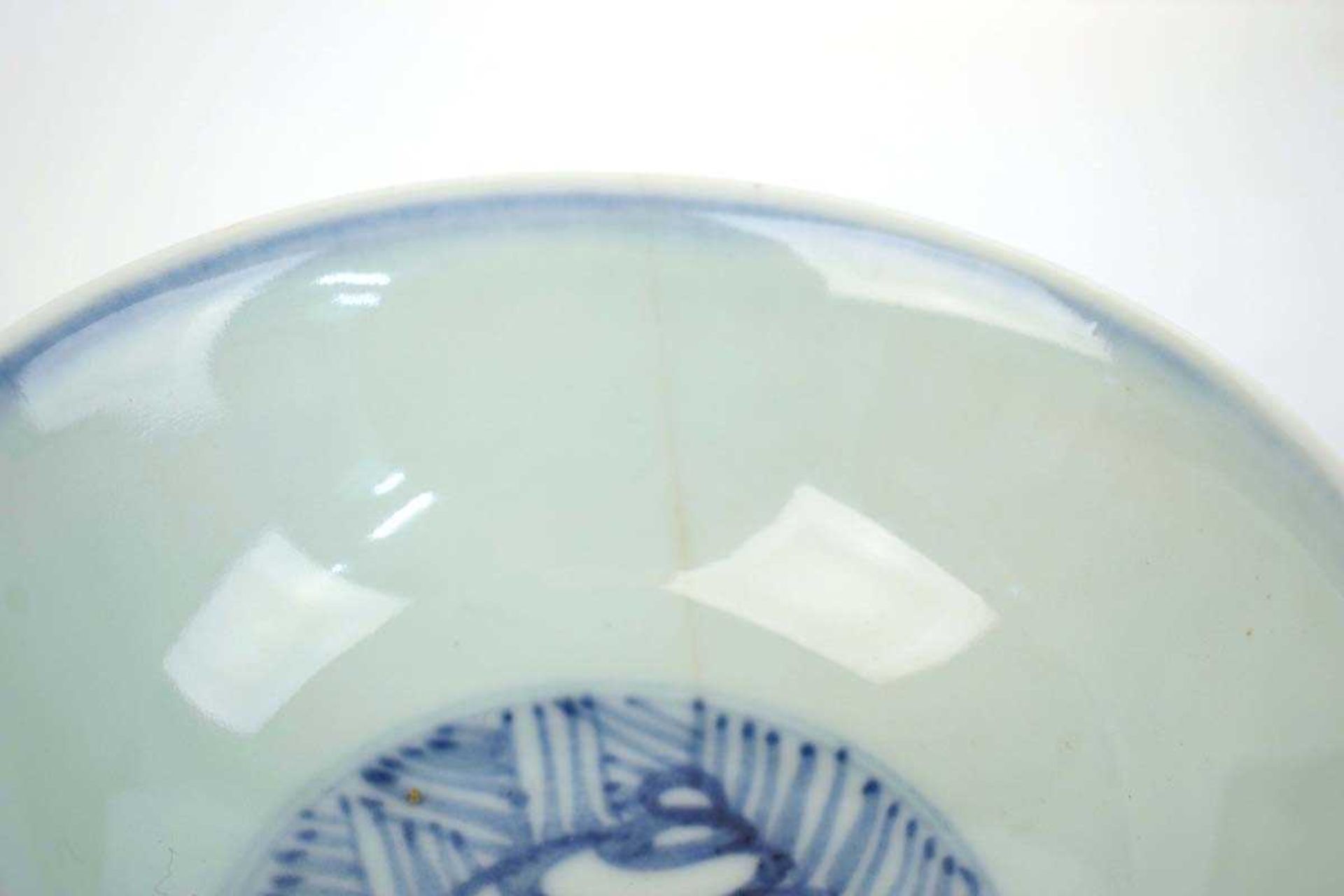 A Chinese blue and white bowl of flared form, externally decorated with scrolls of stylised - Image 3 of 22