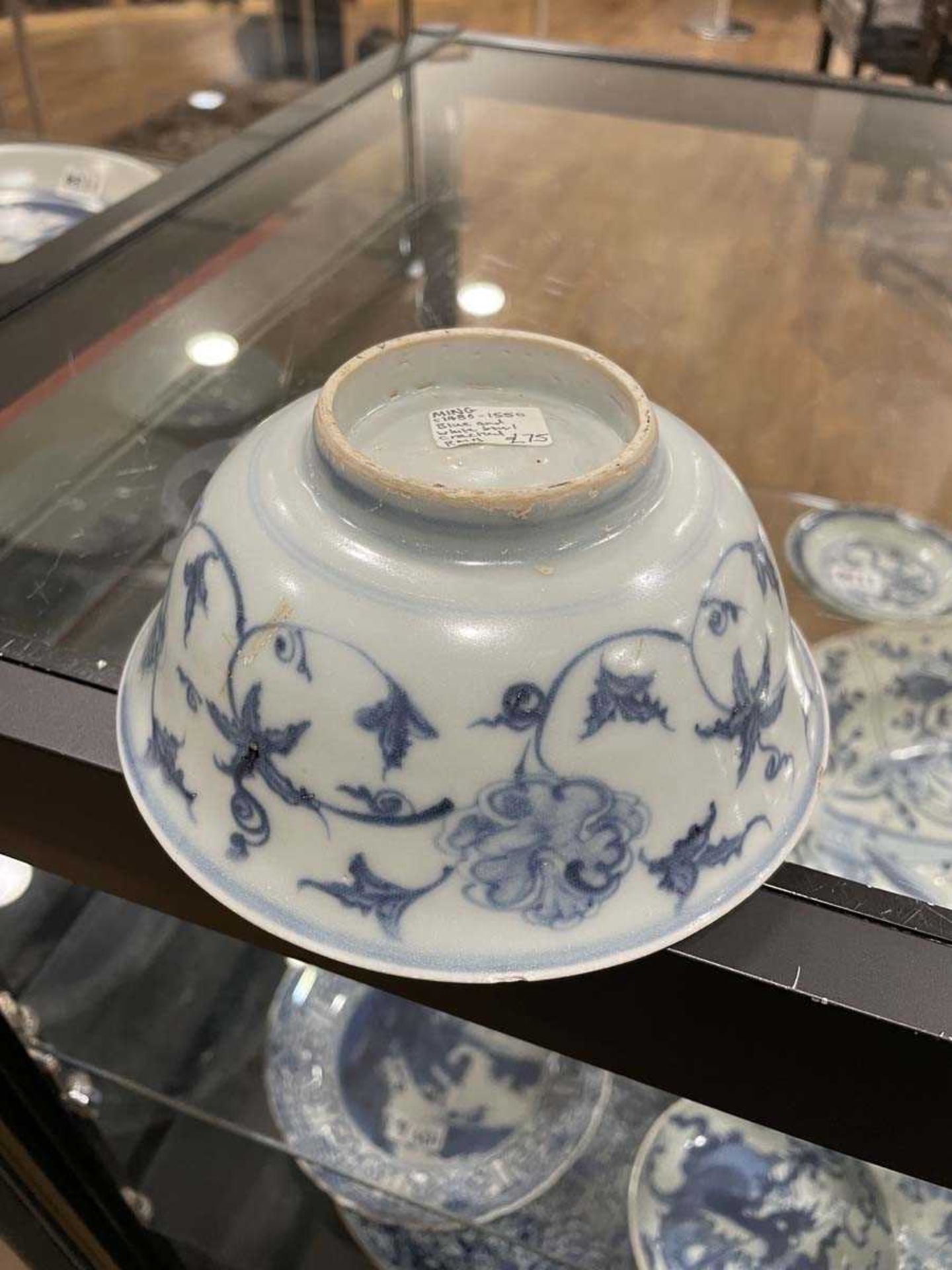 A Chinese blue and white bowl of flared form, externally decorated with scrolls of stylised - Image 8 of 22