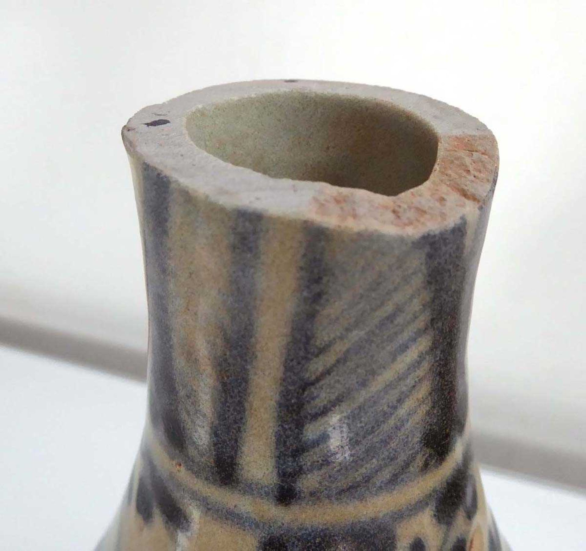 A blue and white stoneware bottle vase of squat form decorated with stylised foliate motifs, h. 24 - Image 2 of 3