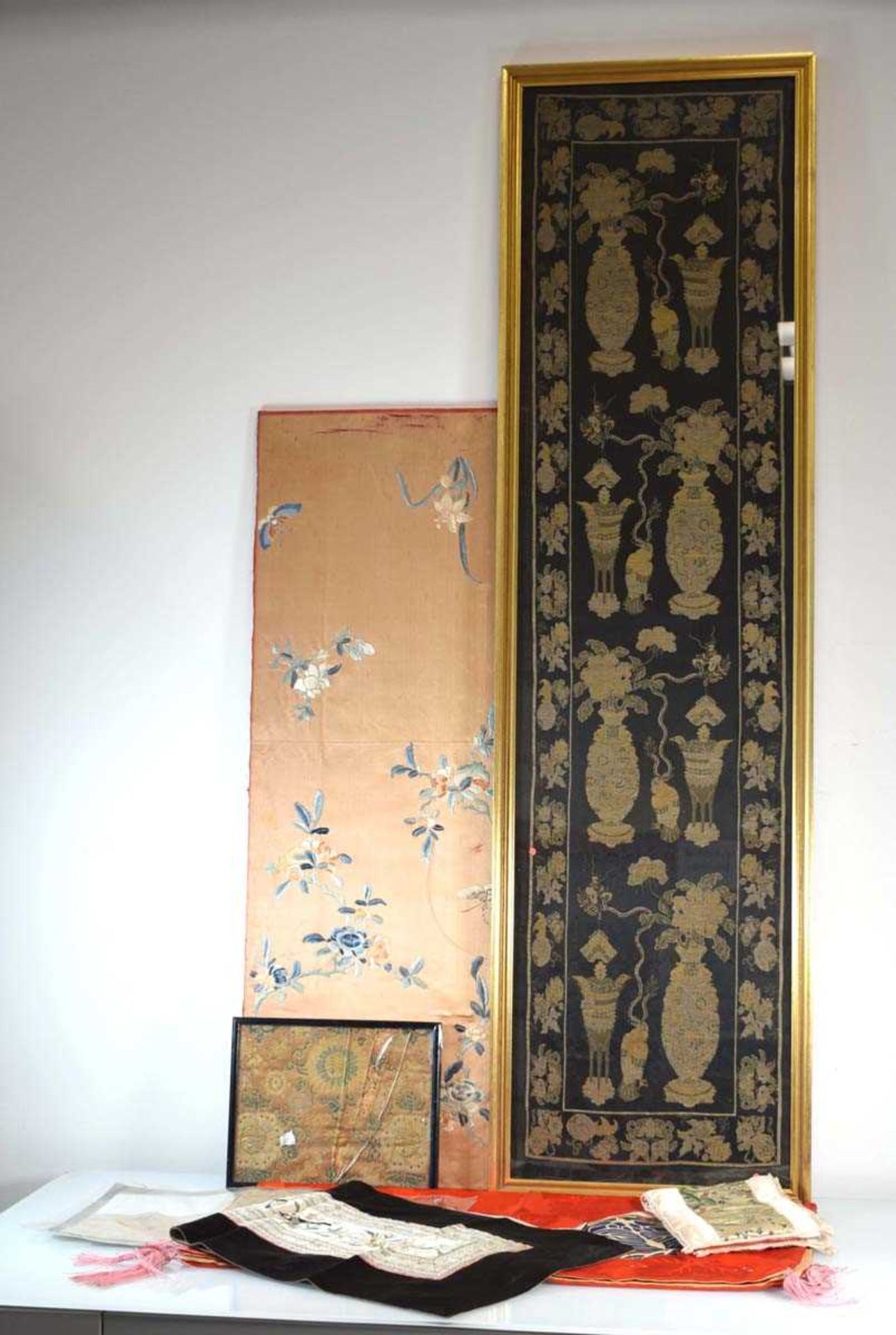 A Chinese silk panel embroidered with blossoms and butterflies, 94 x 34 cm, a machine made panel