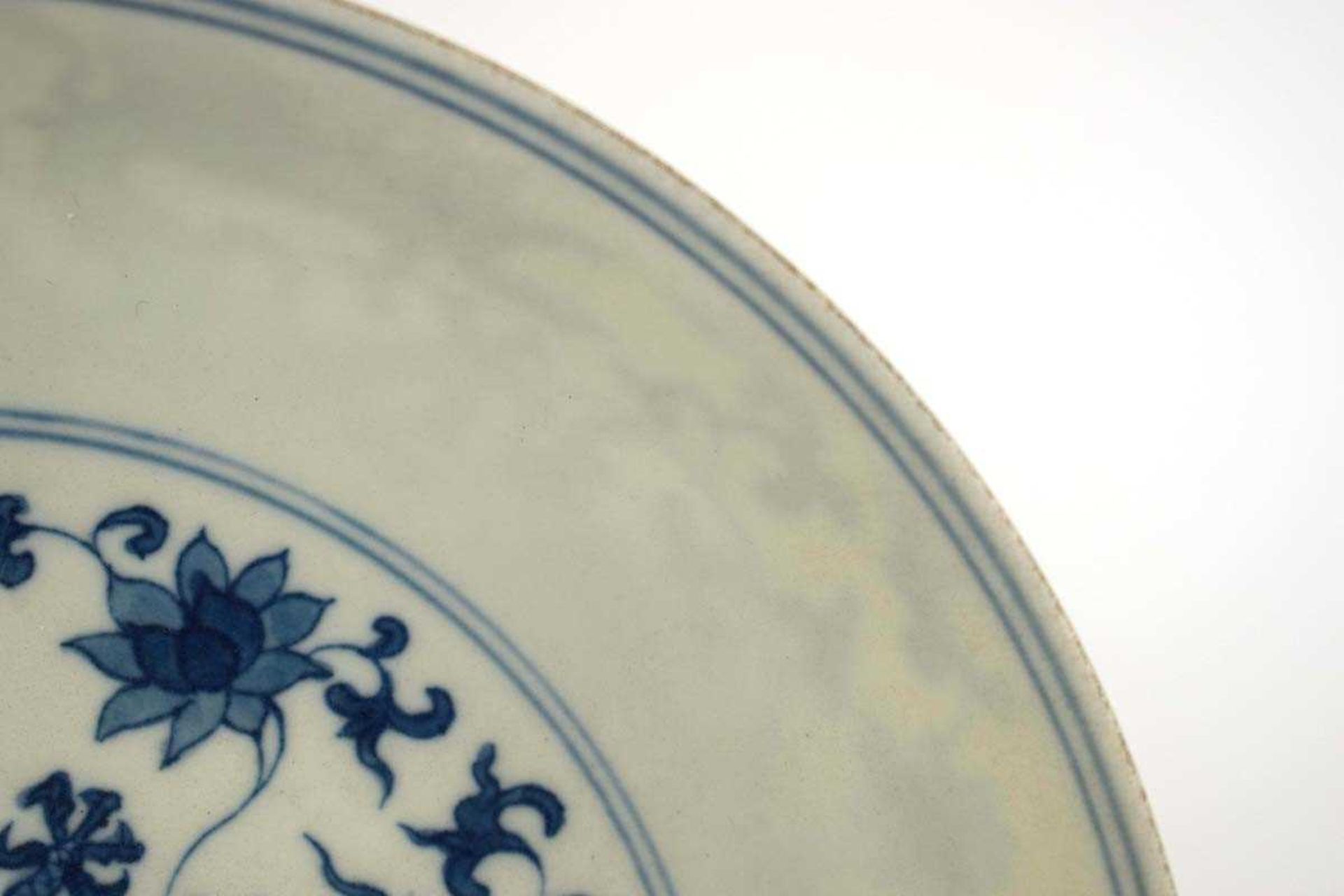 A Chinese blue and white shallow dish, centrally decorated with a dragon and lotus flowers, pseudo - Image 3 of 31
