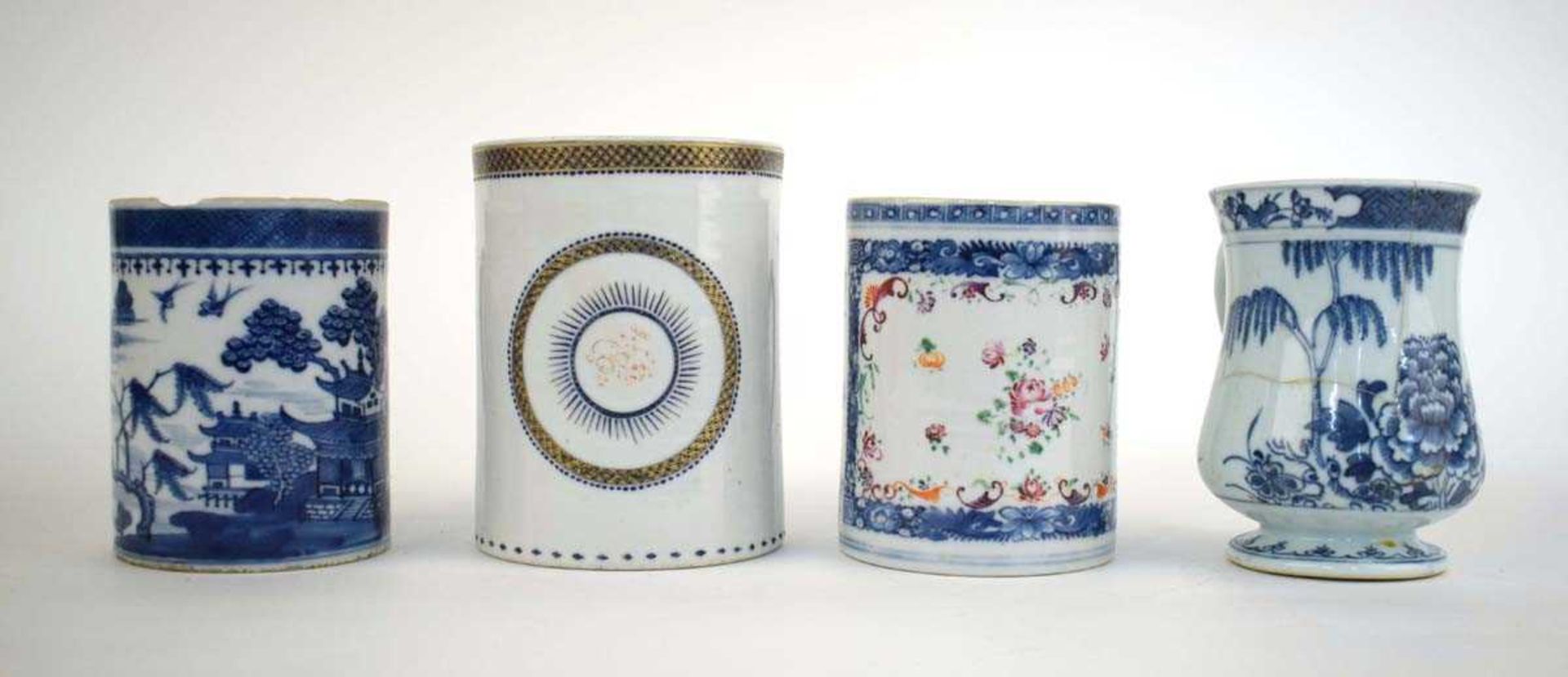 A Chinese Export blue and white tankard with entwined handle and concentric ring decoration, h. 14