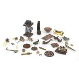 A mixed group of Oriental metalware including a tower, h. 9.5 cm, a wheelbarrow, a rickshaw, pins, a