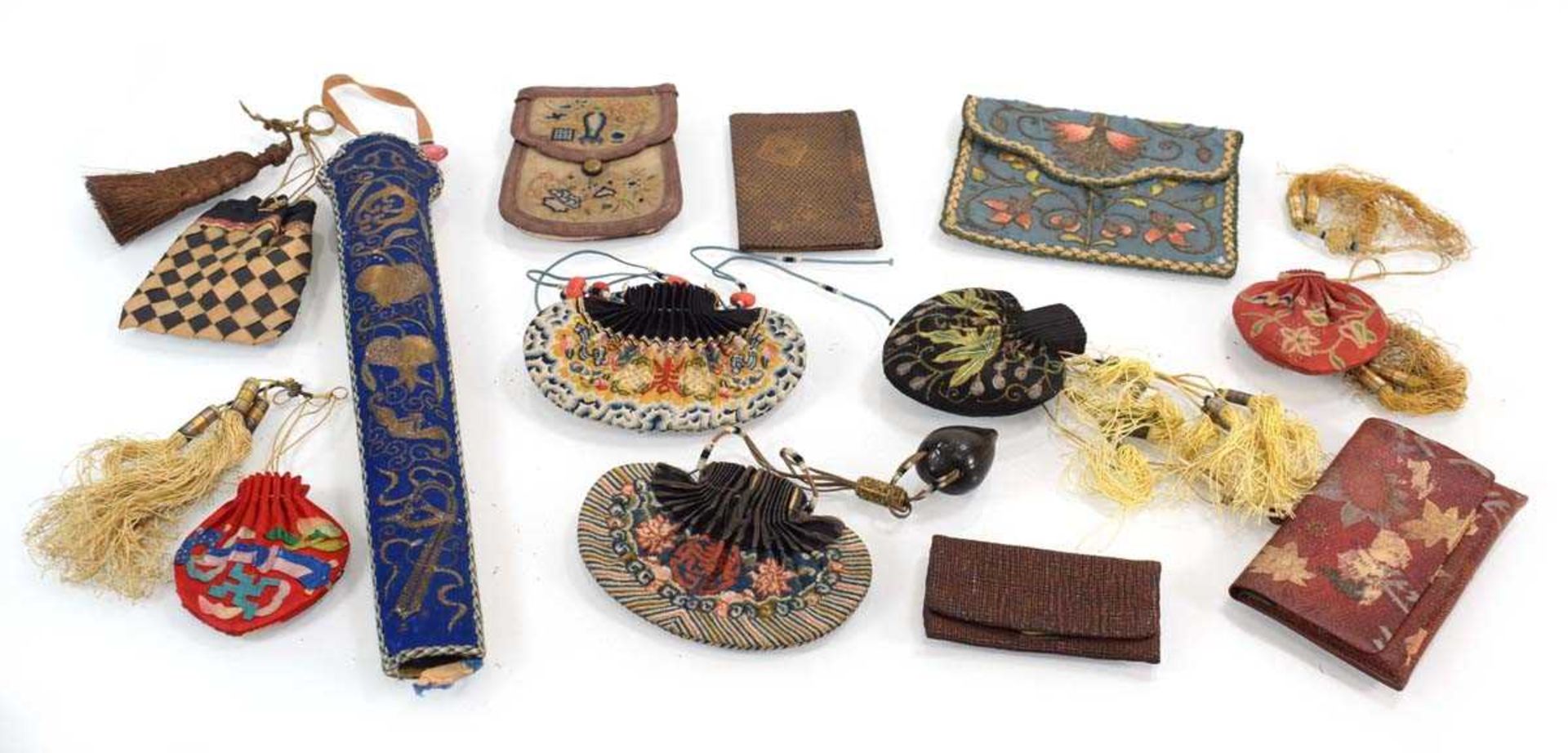 A Chinese embroidered blue/cream silk fan case, l. 33 cm, together with eleven further pouches and