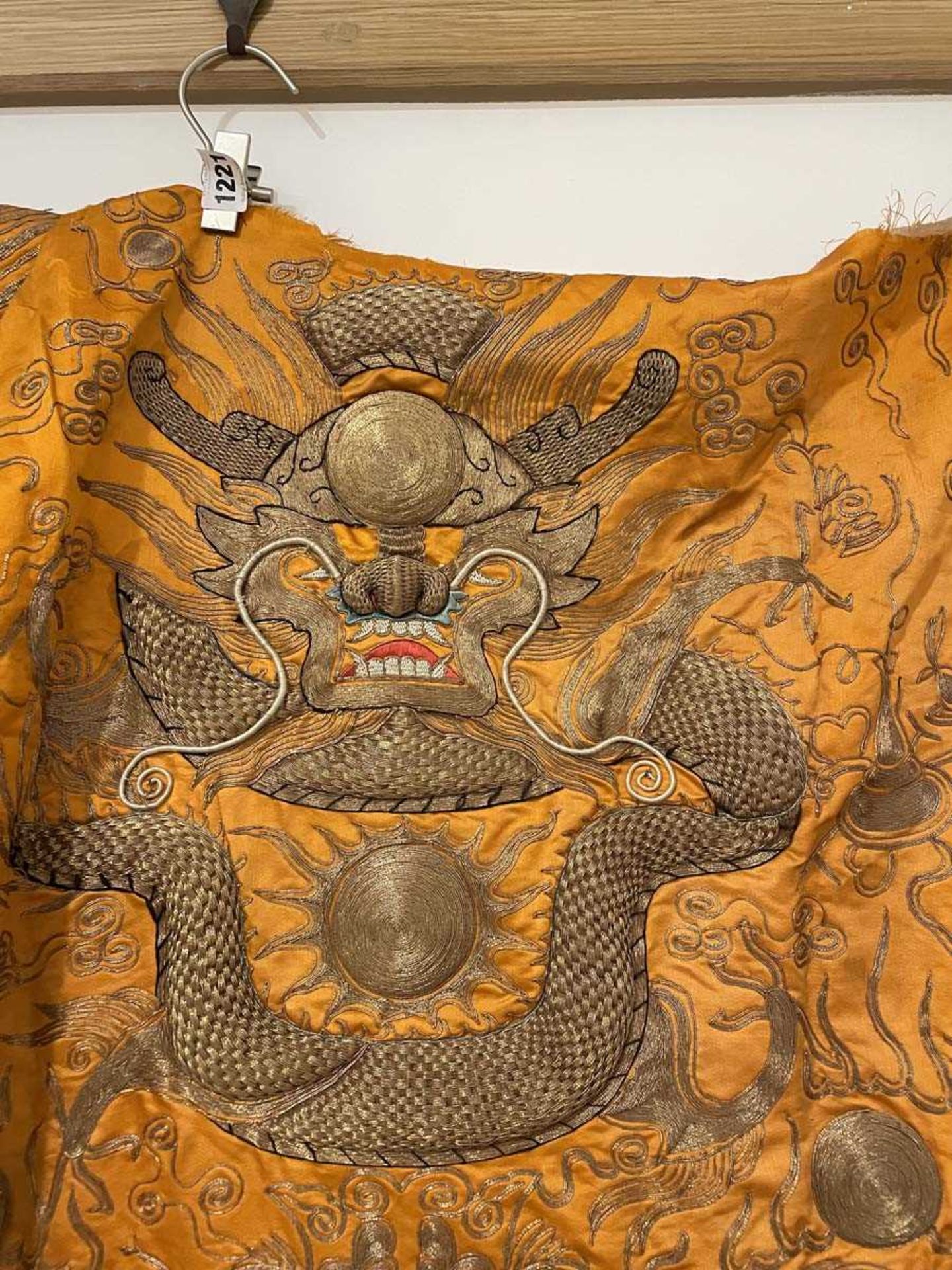A Chinese robe section worked in gold coloured threads depicting dragons and a pagoda on an orange - Bild 4 aus 15