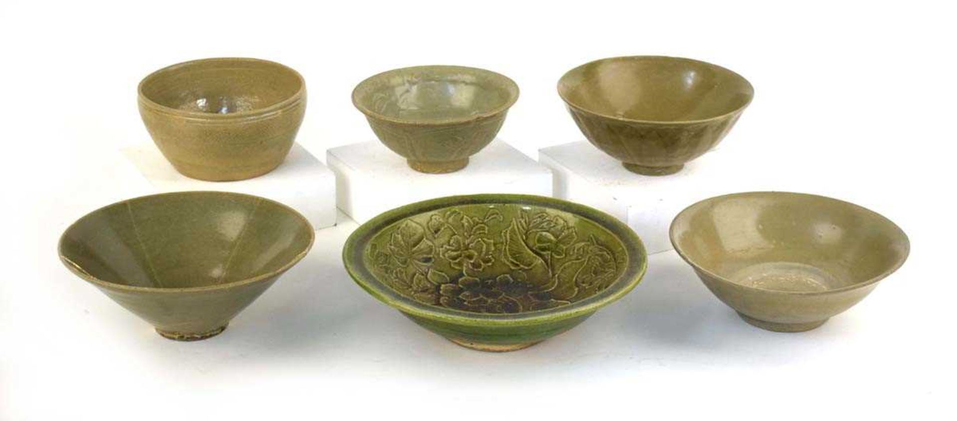A Chinese celadon bowl of circular form repaired with the Kintsugi technique, d. 19.5 cm, h. 7.5 cm,