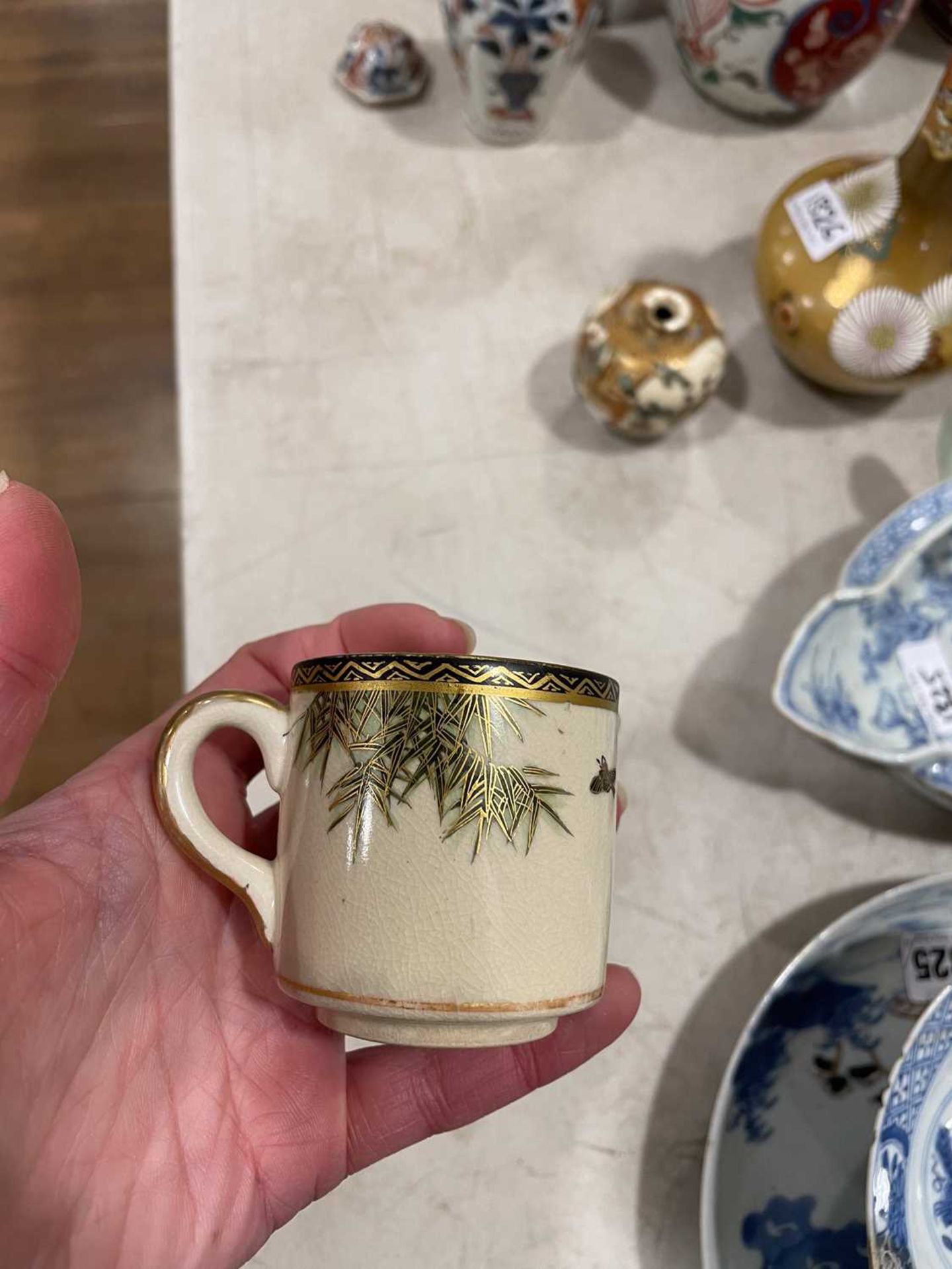 A Japanese satsuma bowl of flowerhead form, centrally decorated with peacocks within a landscape, - Image 11 of 41