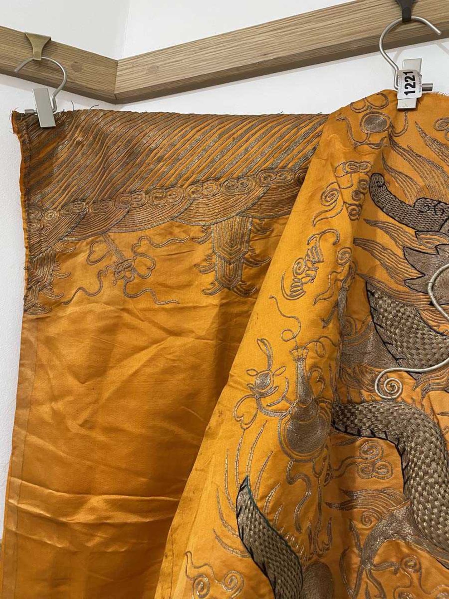 A Chinese robe section worked in gold coloured threads depicting dragons and a pagoda on an orange - Bild 9 aus 15