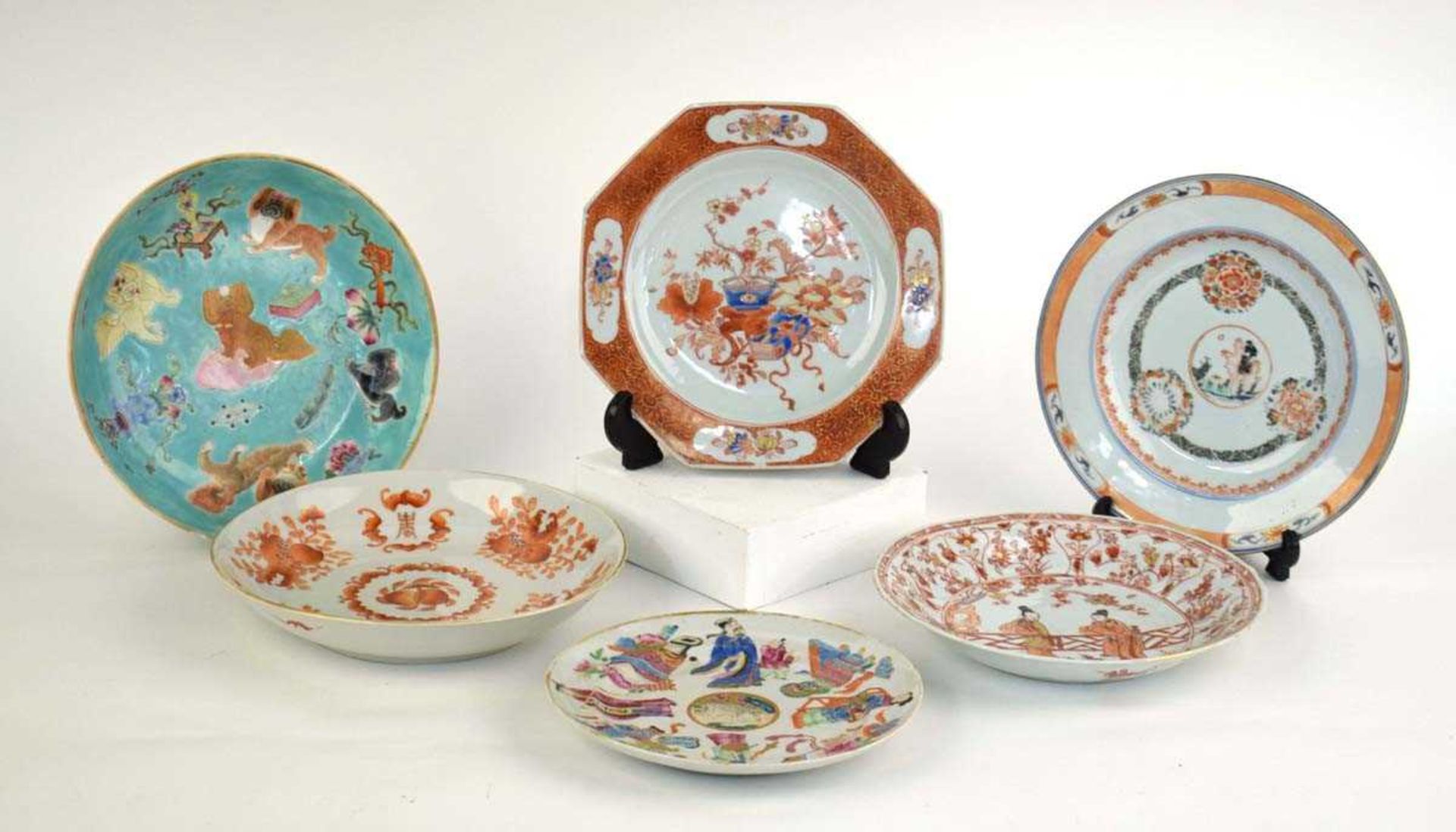 A Cantonese shallow dish all over decorated in coloured enamels with Pekingese dogs, d. 23.5 cm,
