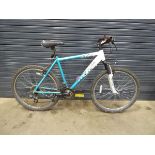 Turquoise and white Apollo gents mountain bike