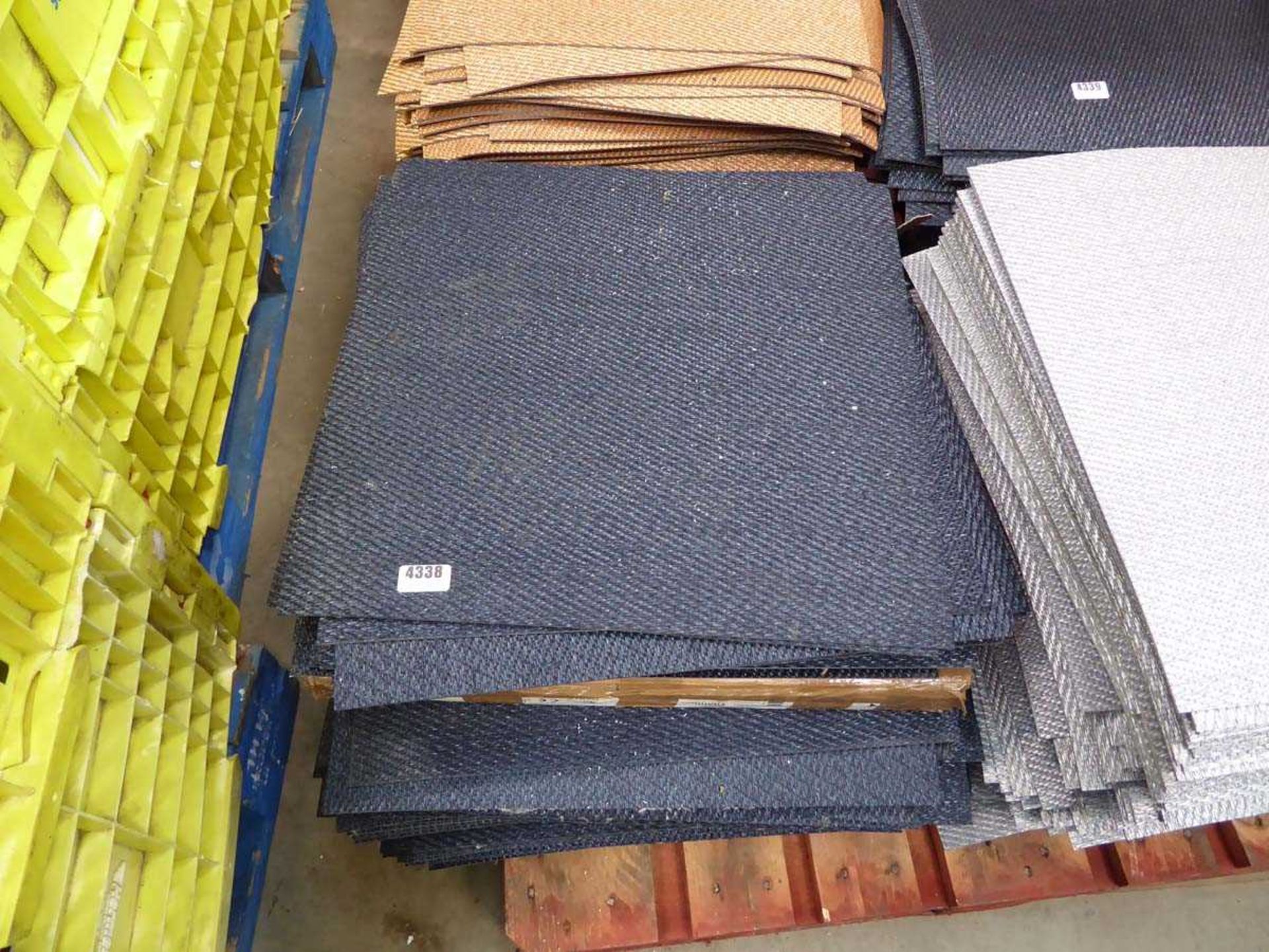 Stack of blue carpet tiles