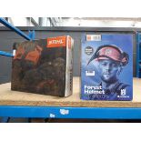 Husqvarna Forest functional chainsaw helmet boxed and box of Stihl Ergo chainsaw trousers