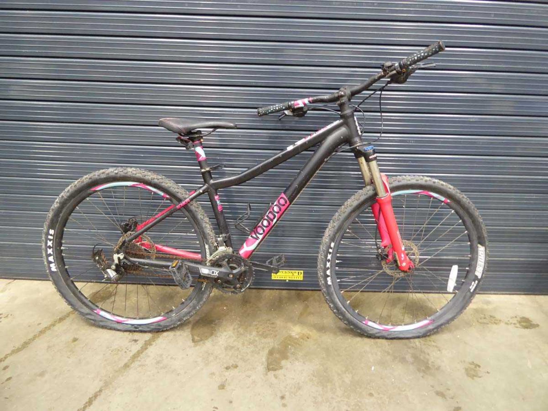 Black and pink gents mountain bike with detached rear wheel