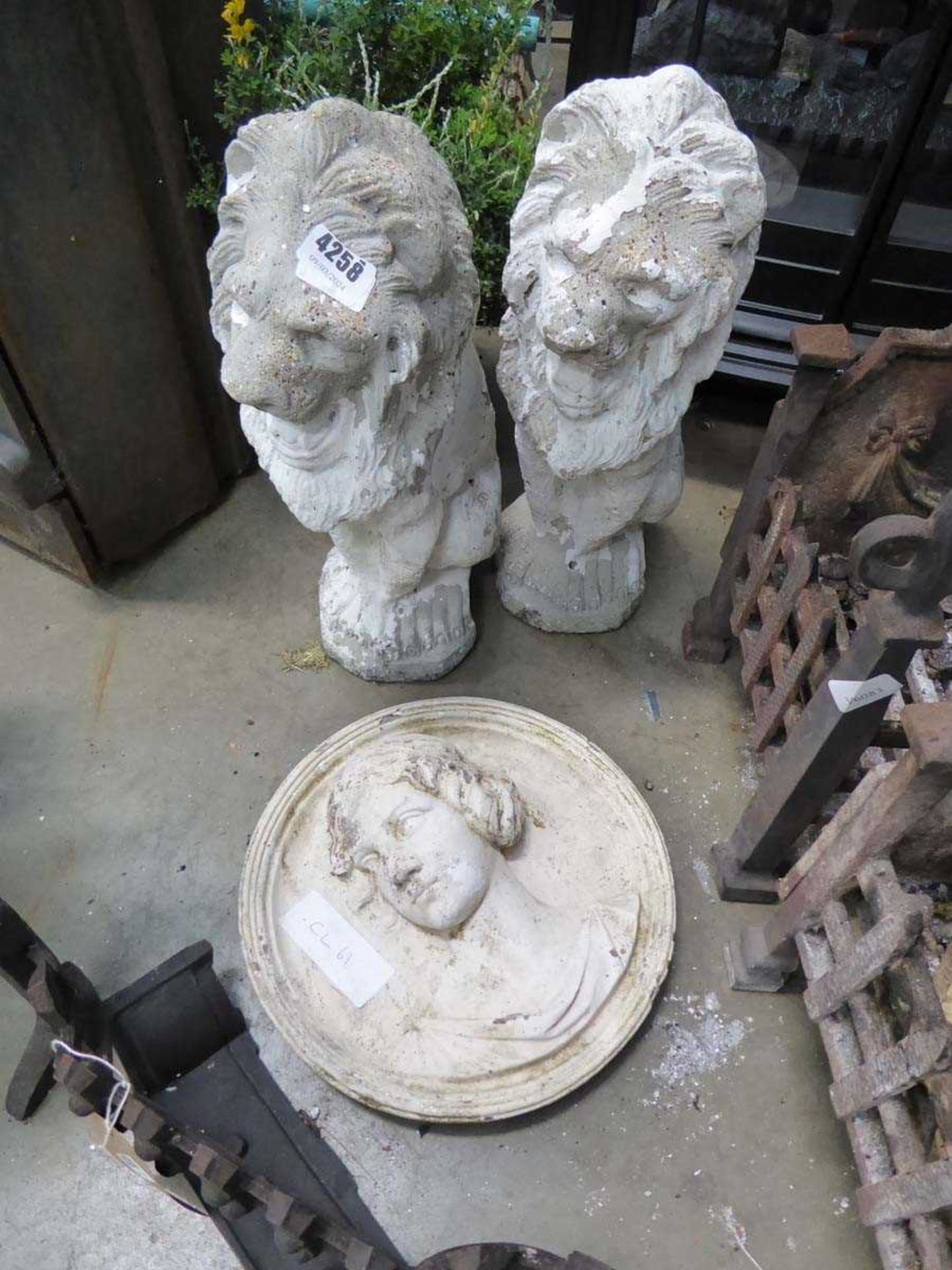 Concrete plaque of a ladies head plus 2 concrete lions