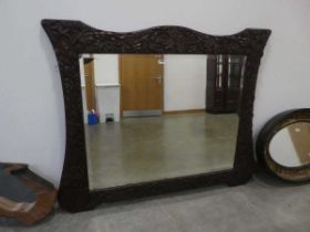 Large rectangular bevelled mirror in oak leaf and acorn patterned frame