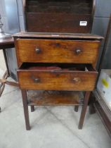 Fruitwood two drawer cabinet with a quantity of brushes, gloves and umbrellas