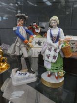 2 ornamental figures, fruit picker and a military officer
