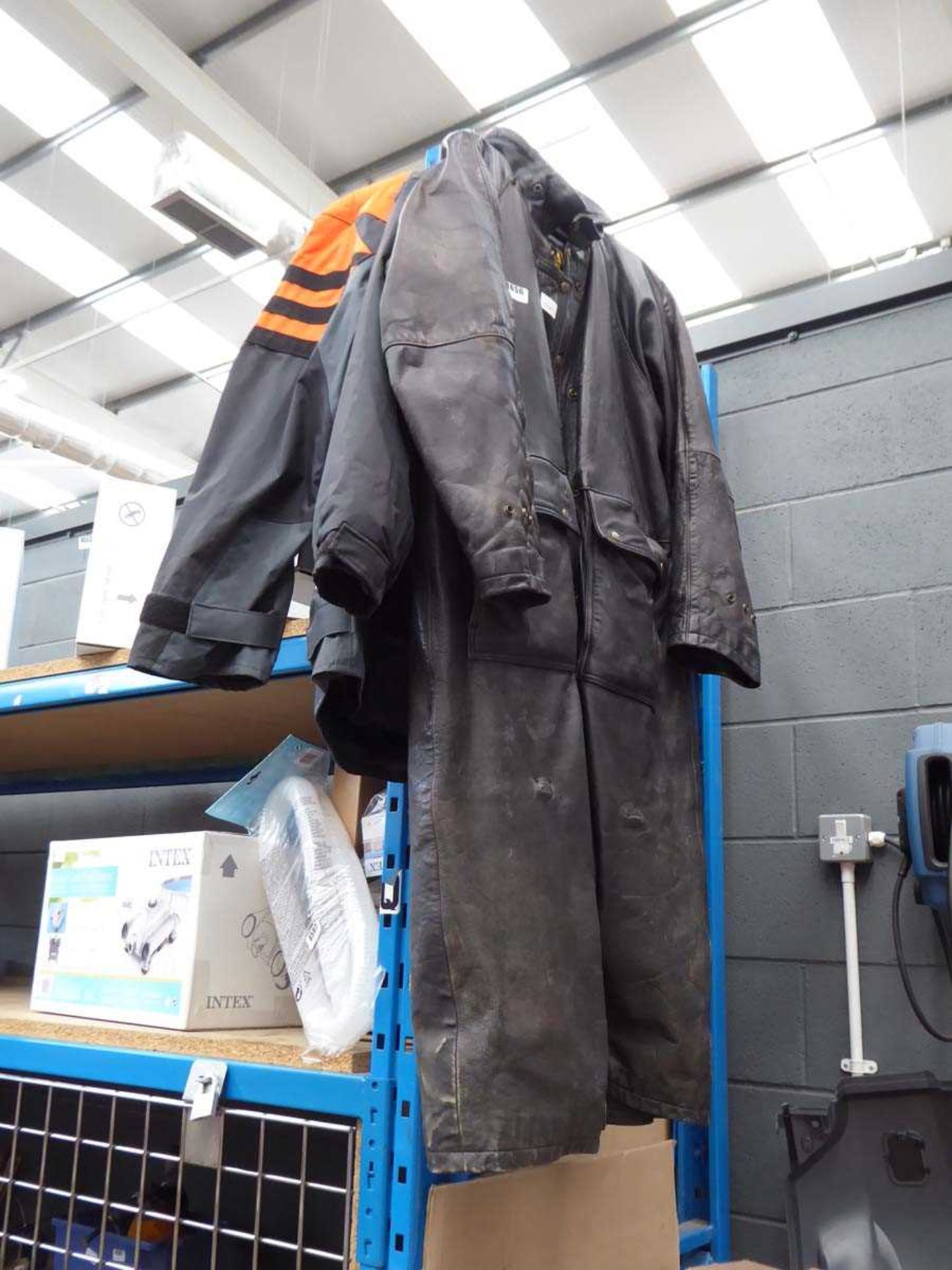 Long motorcycle coat and 2 motorcycle jackets together with box containing gloves