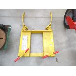 Large yellow fork lift drum handler