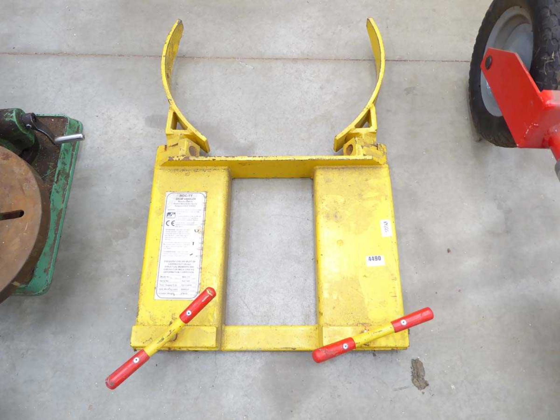 Large yellow fork lift drum handler