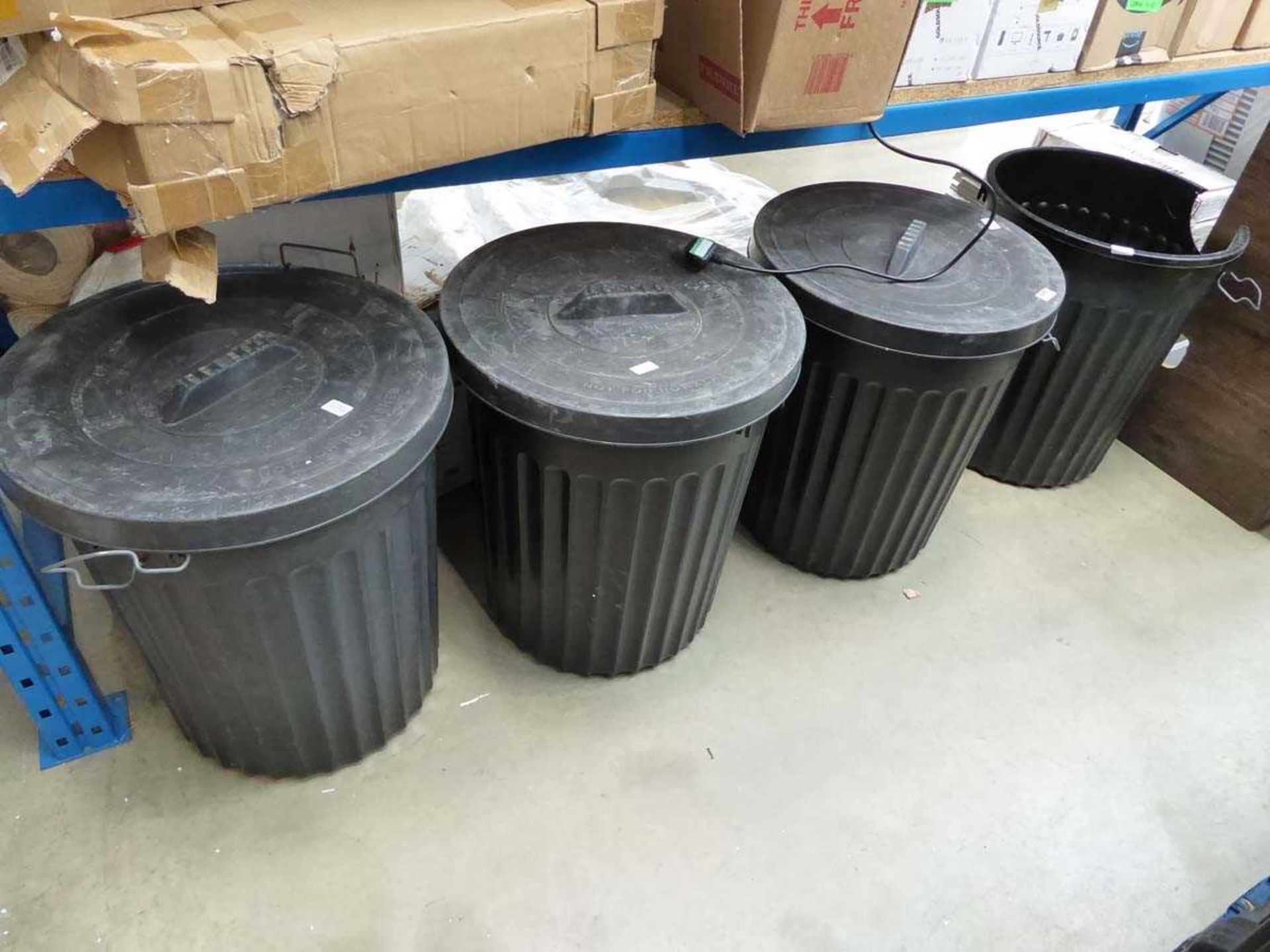 4 large rubbish bins containing white cable clips