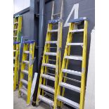 8 tread yellow and silver electricians style stepladder and a single section of an aluminium ladder