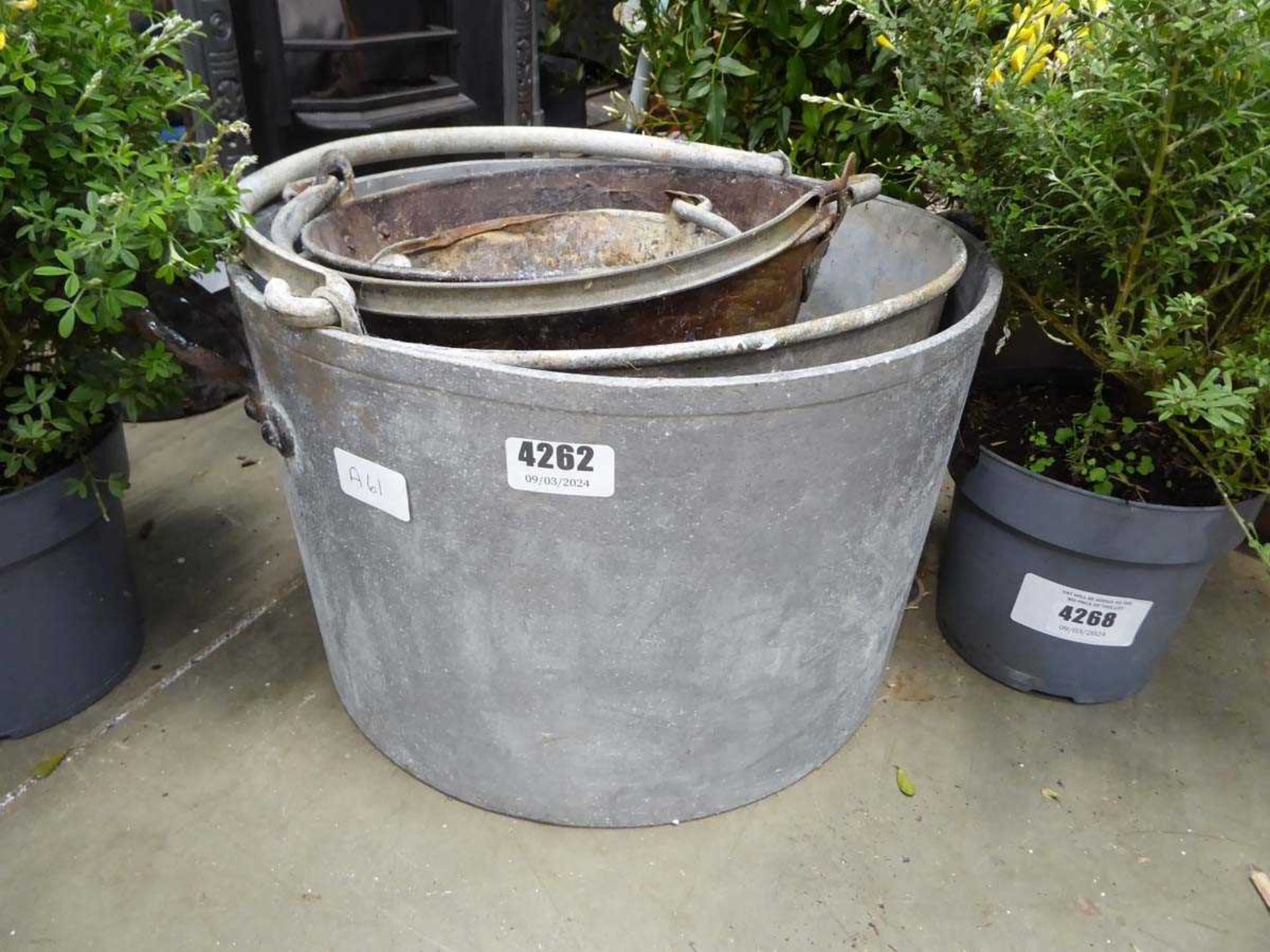 Four galvanised buckets of assorted size