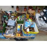 Large pallet of assorted items including tools, clamps, screws, old chainsaws, etc