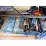 Quarter of an under bay containing various toolboxes with saws, hammers, measures, etc