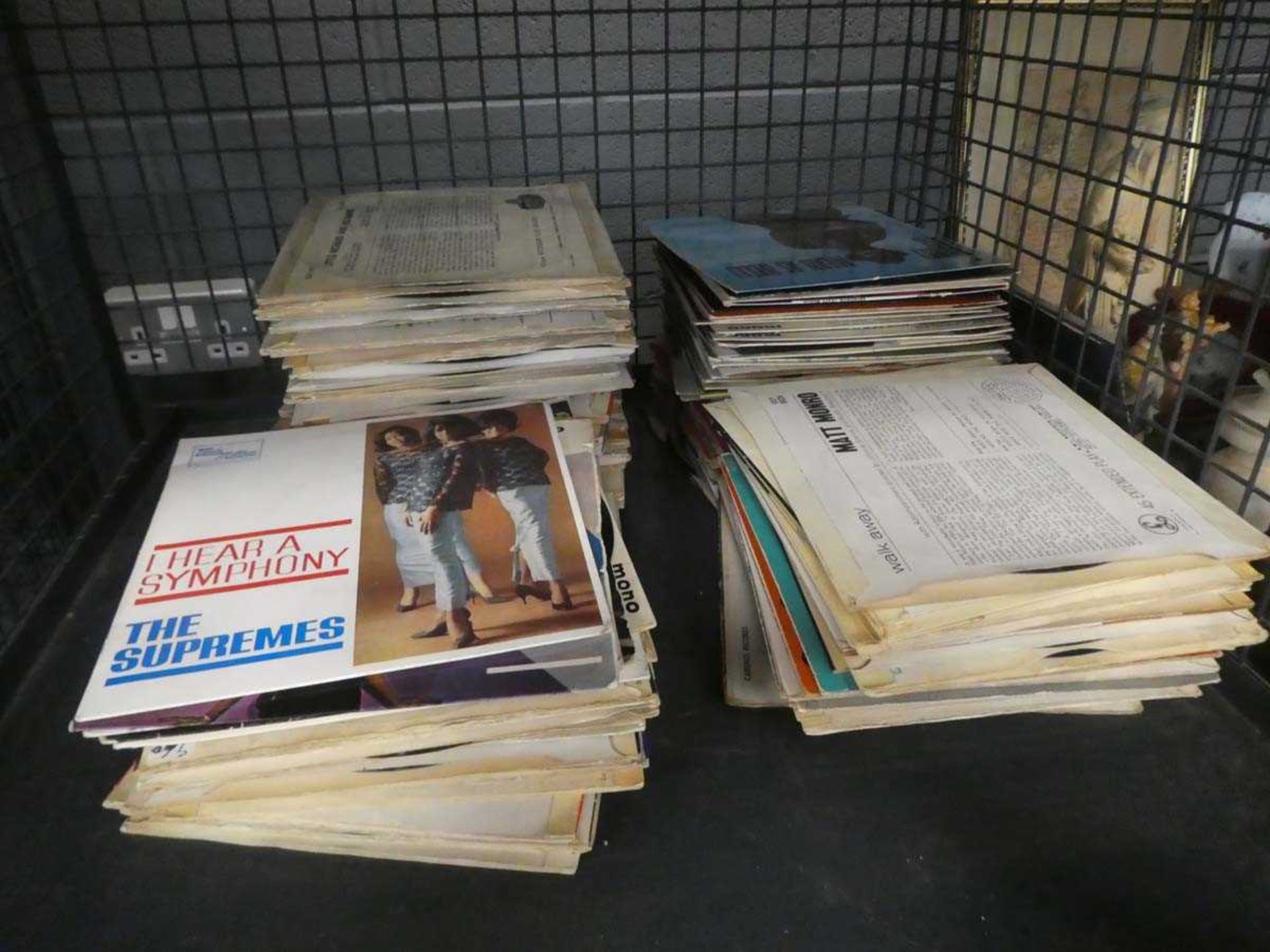 Cage containing quantity of EP vinyl records