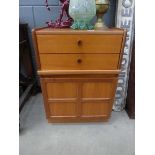 Nathan single door cabinet with two drawers over