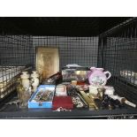 Cage containing miniature buddhas, costume jewellery, coinage, ornamental figures, and map