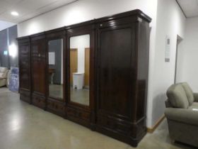 An imposing sectional Victorian (and later) rosewood five-door wardrobe with two mirrored doors.