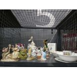 Cage containing Beatrix Potter pottery, plus ornamental figure, peasant girl, and rose patterned