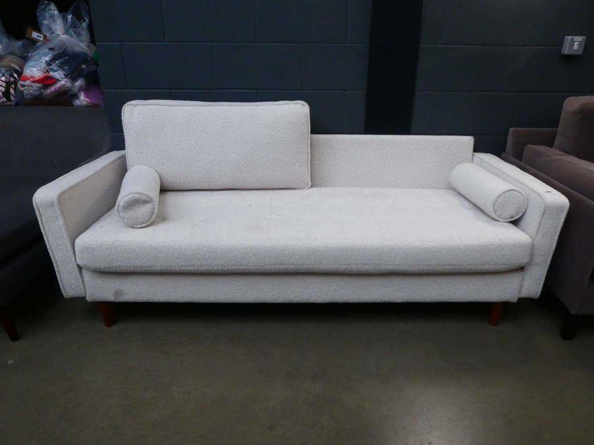 Cream sofa One back cushion missing