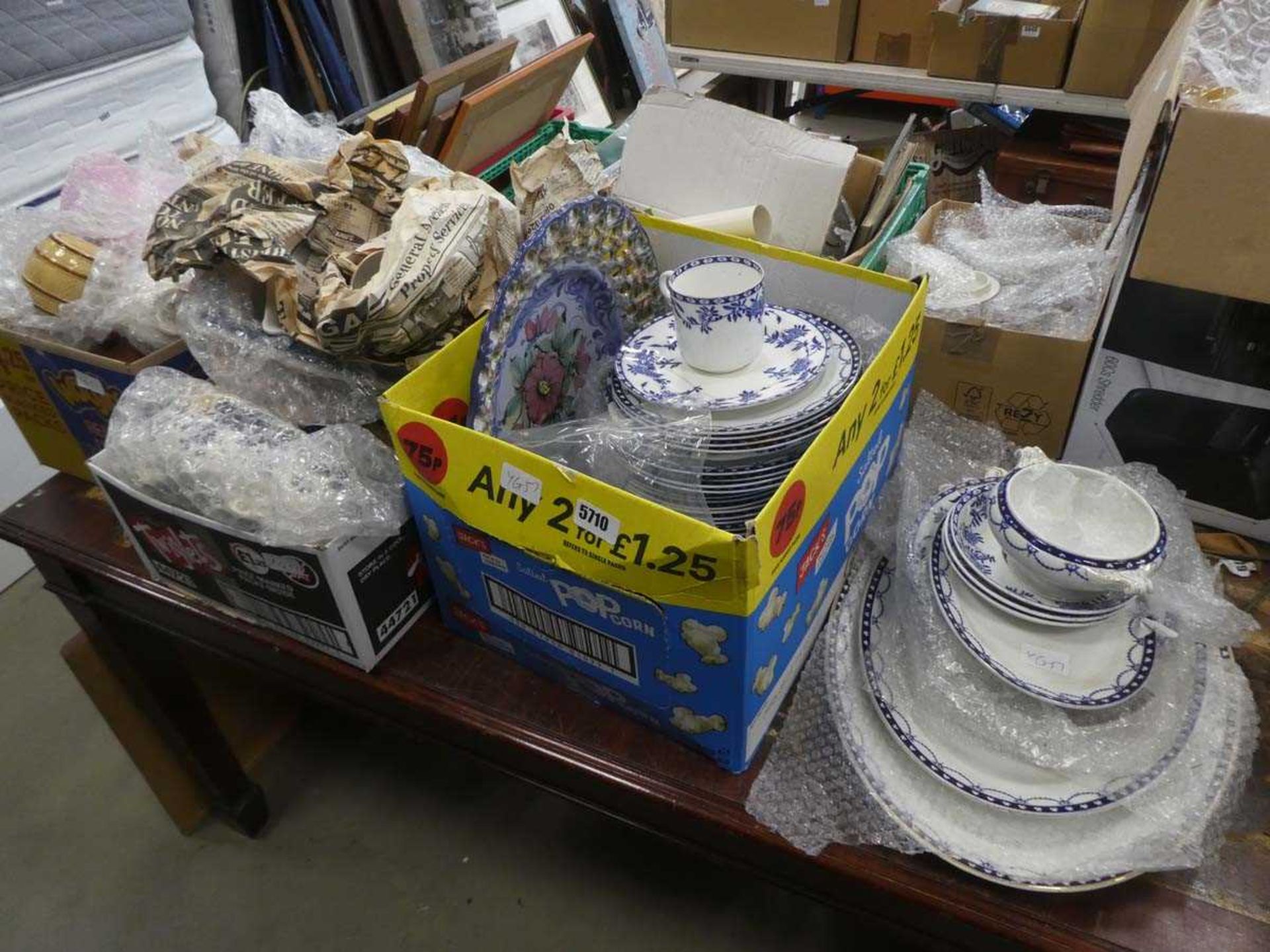 Two boxes and stack of blue and white and other crockery, TY toys and cutlery