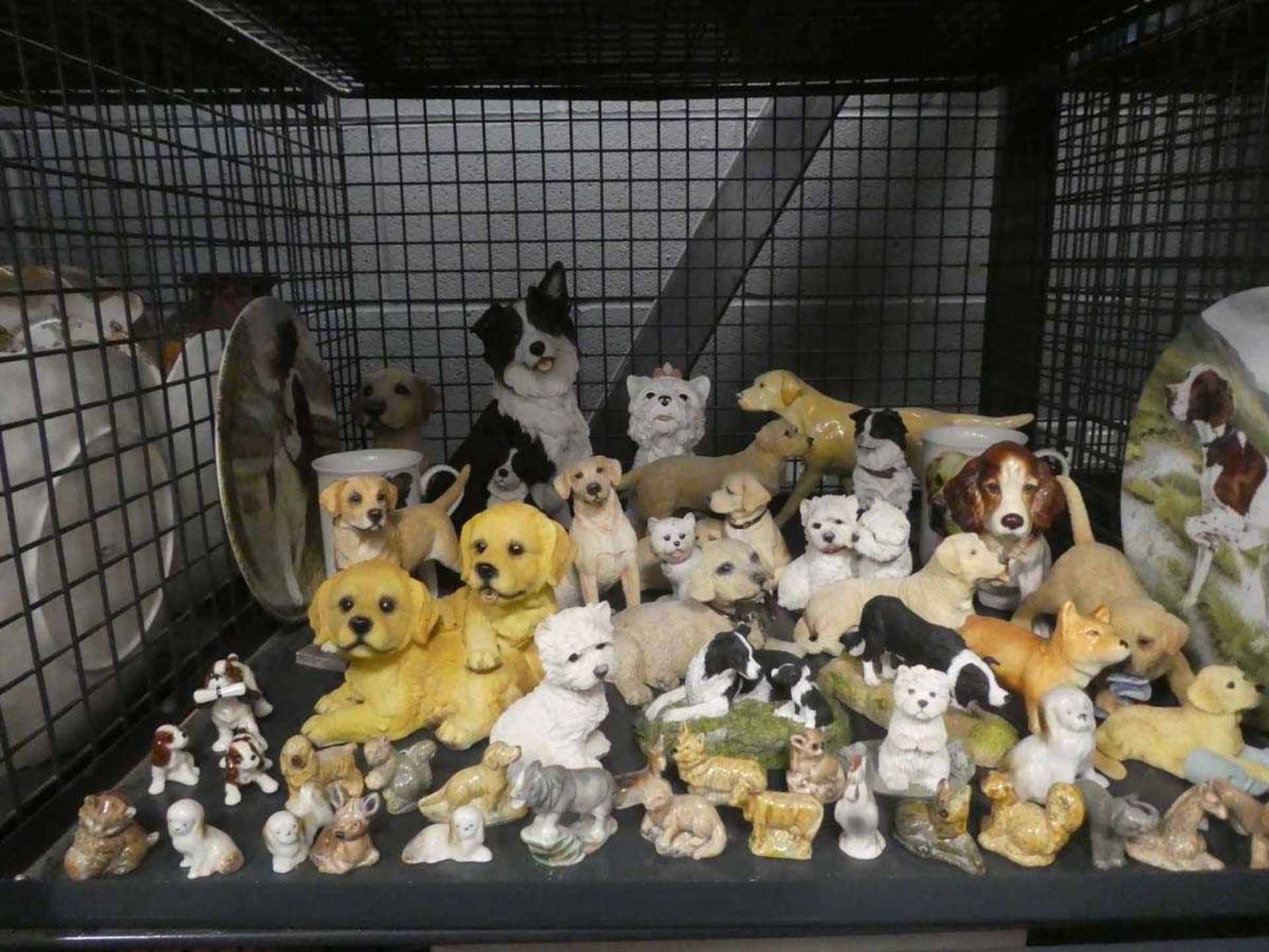 Cage containing ornamental dogs, collectors plate, wade whimsies