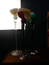 Three glass candlesticks