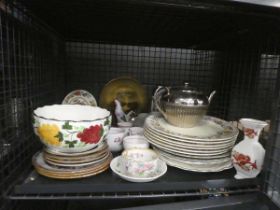 Cage containing floral patterned crockery, plus cups and saucers and teapot