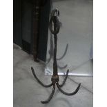 A 19th or 20th century cast iron grapnel anchor/grappling hook, h. 59 cm