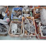 Pallet of vintage motorcycle parts including covers, engine parts, handlebars, chrome parts, etc