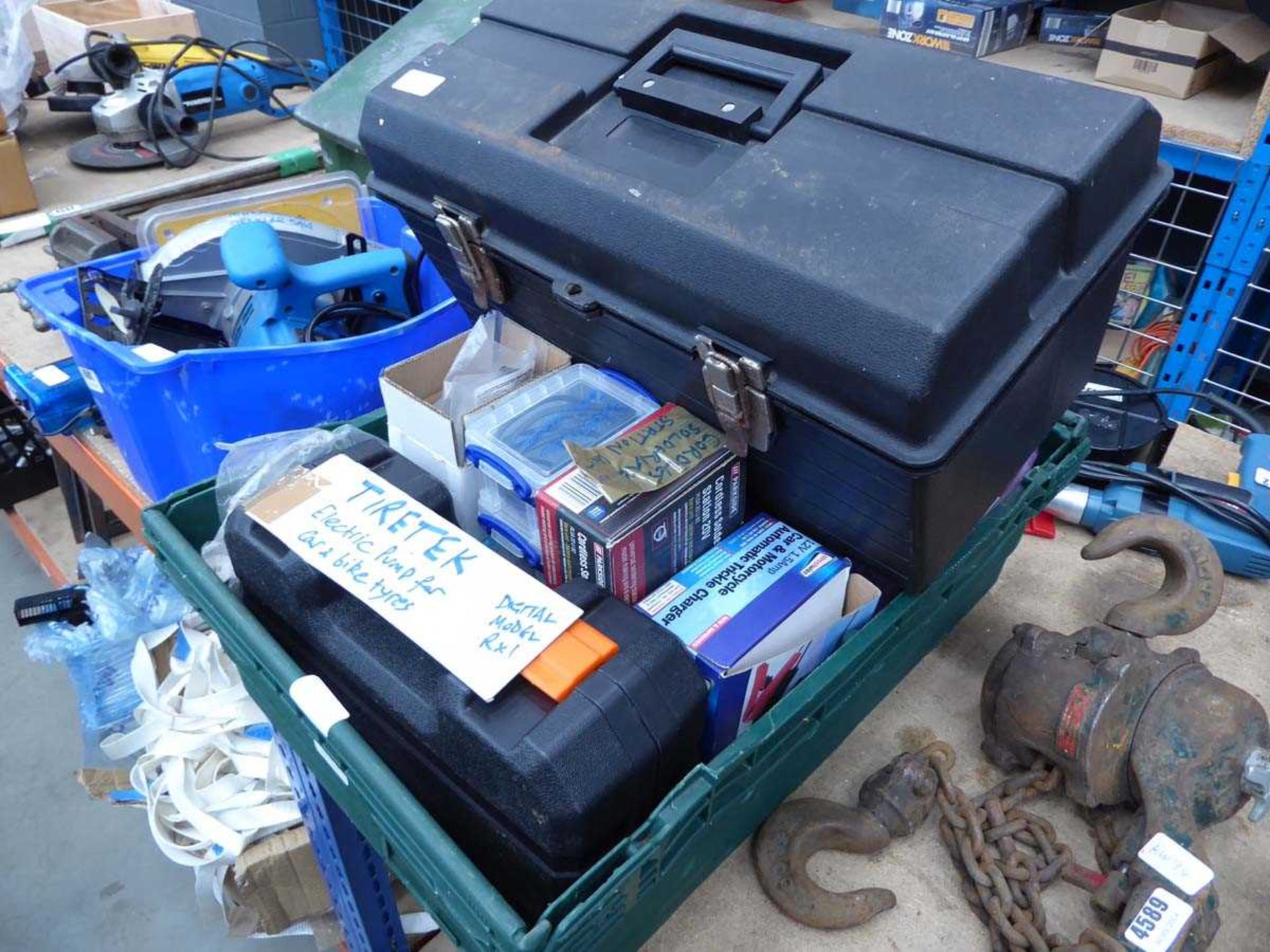 Large plastic crate containing electric pump, fixings, trickle chargers, drill, etc