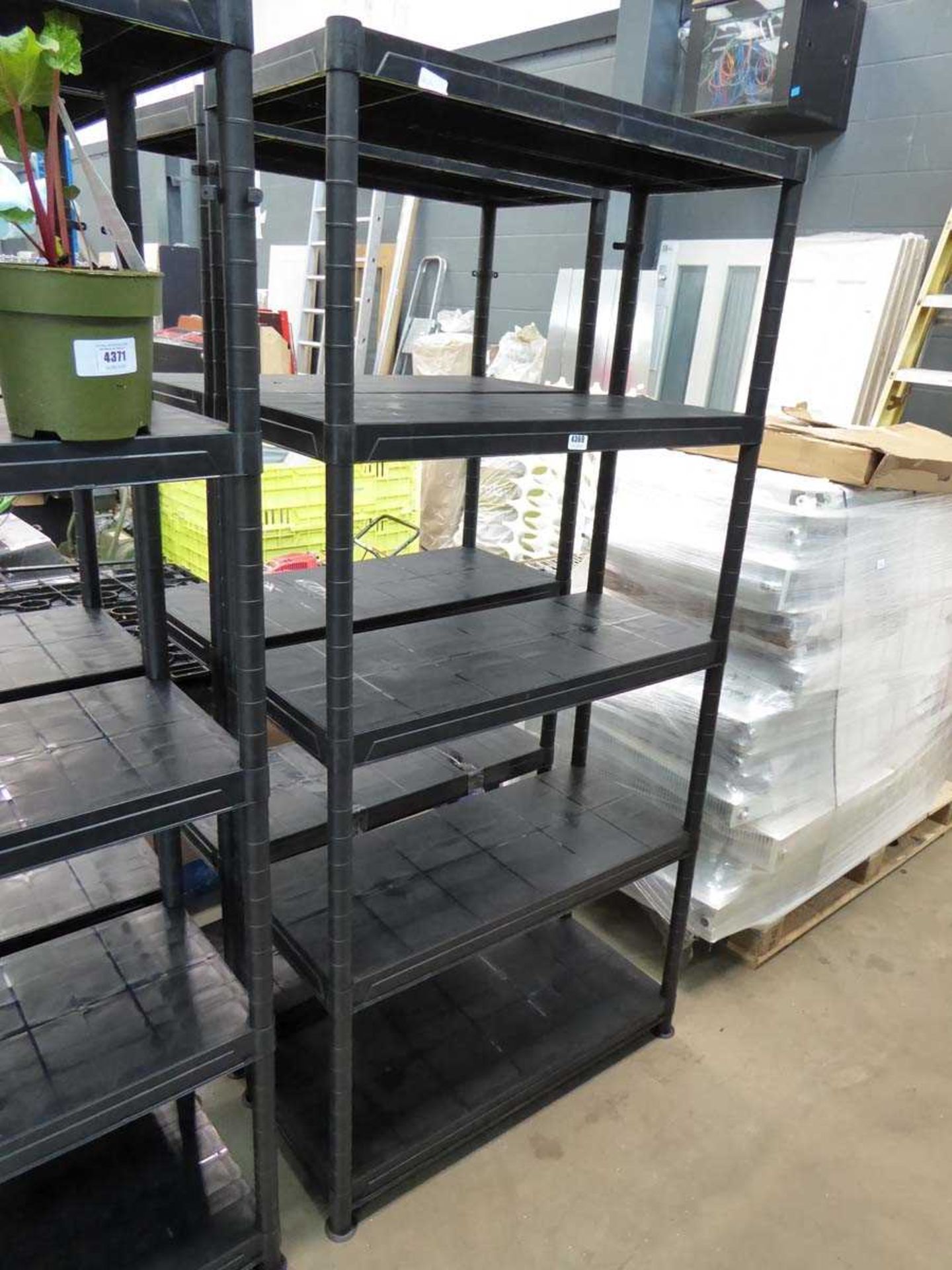 Two black plastic racks