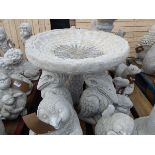 Concrete pelican birdbath