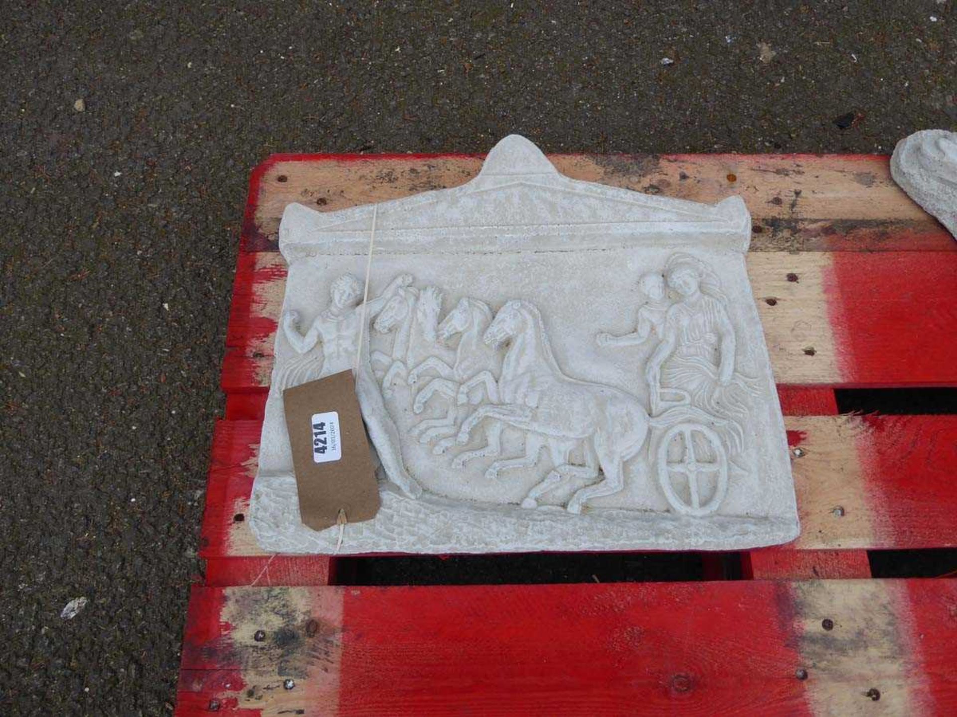 Plaque of horses and chariots