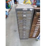 Multi drawer filing cabinet with various assorted fixings and tools