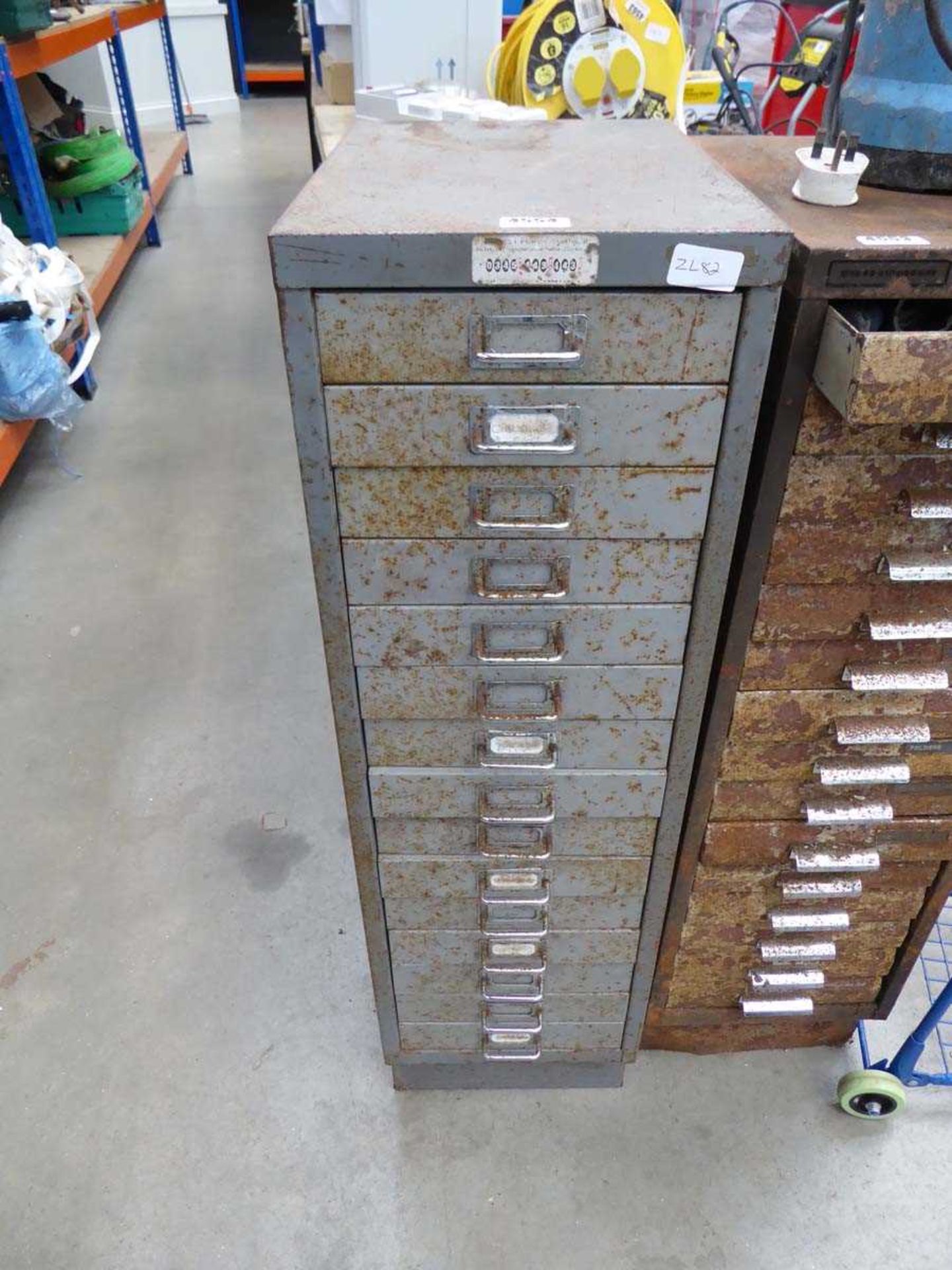 Multi drawer filing cabinet with various assorted fixings and tools