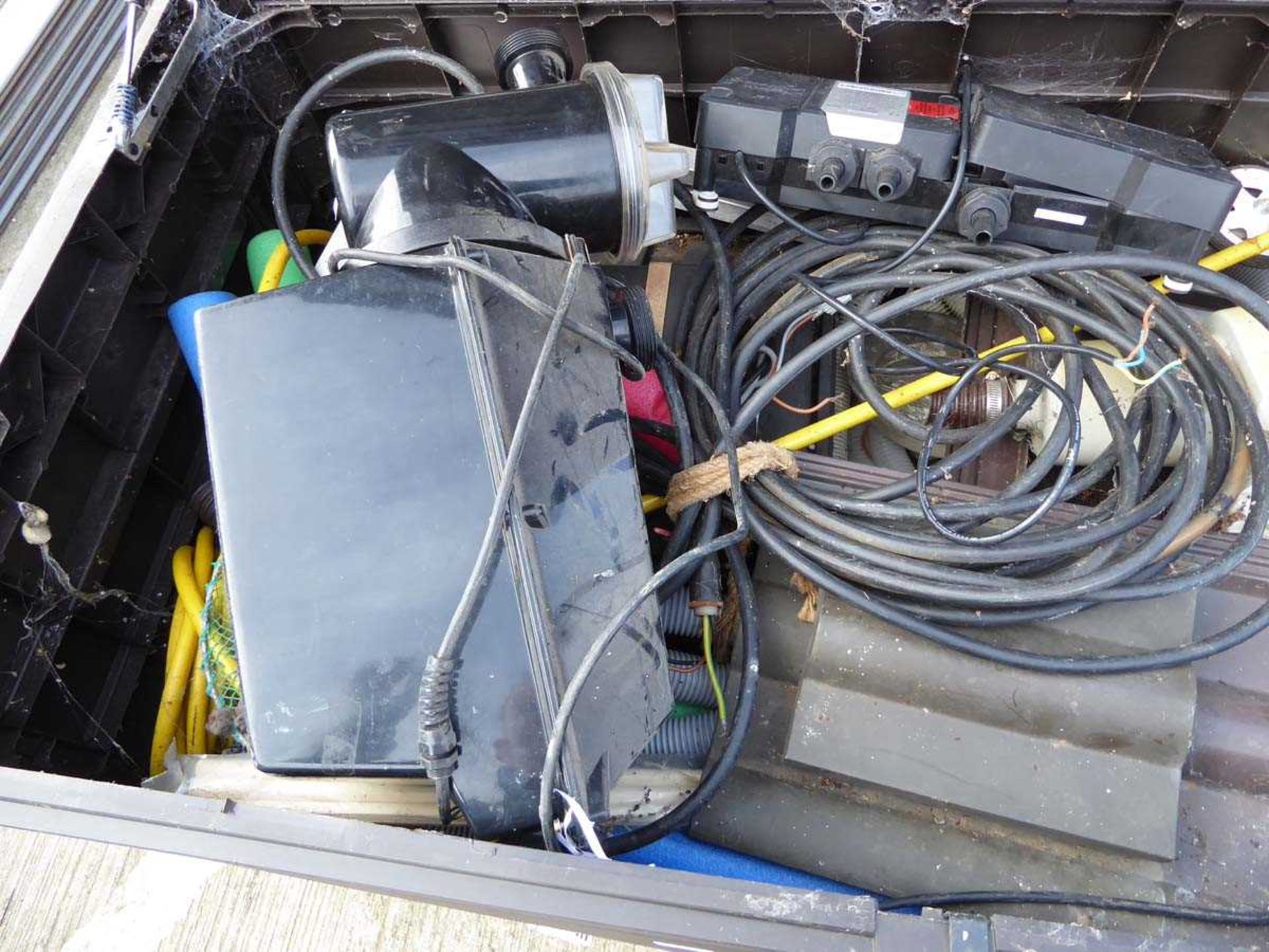 Large plastic box containing various items including pool pumps, pond pumps, filters, nets, etc - Image 4 of 5