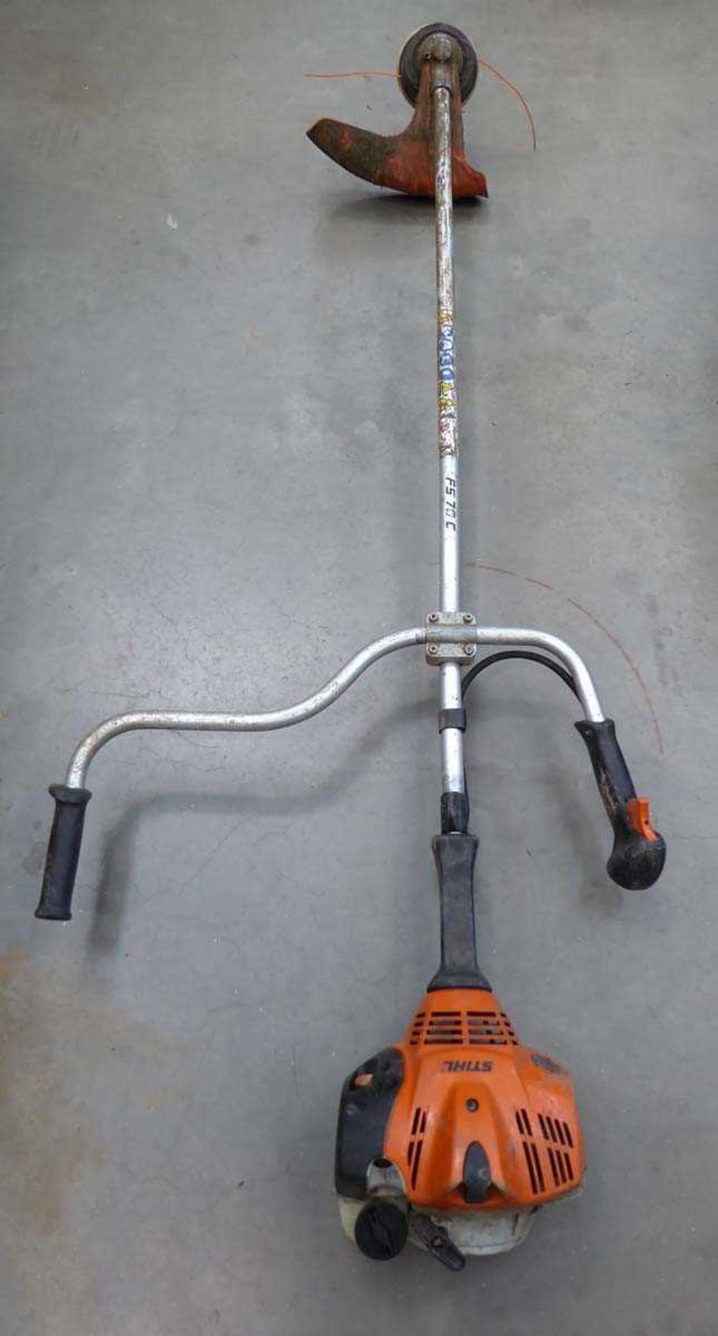 Stihl double handed petrol powered strimmer